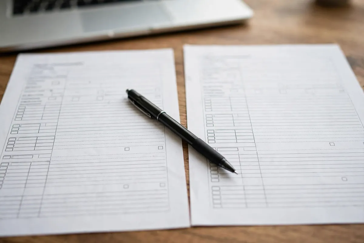 QuickBooks Online duplicate transactions — comparing two printed transaction lists side by side