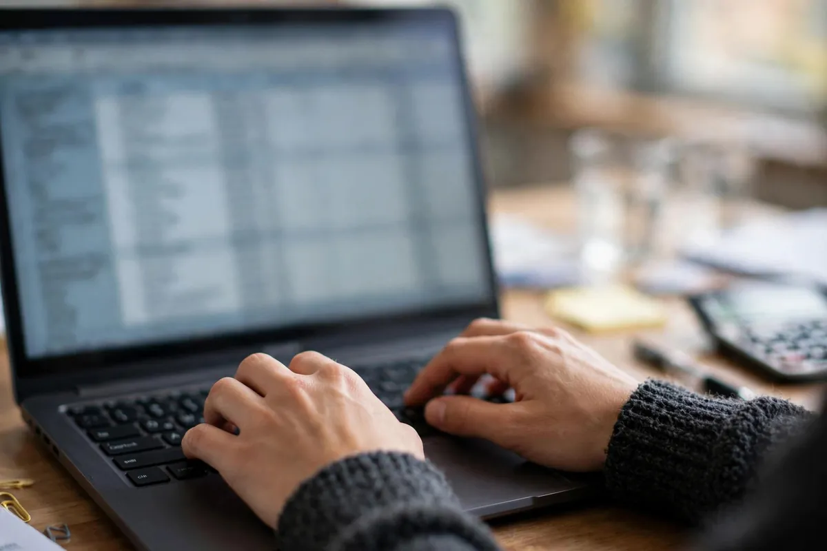 convert HSBC bank statement PDF to CSV for QuickBooks — spreadsheet columns on a laptop screen